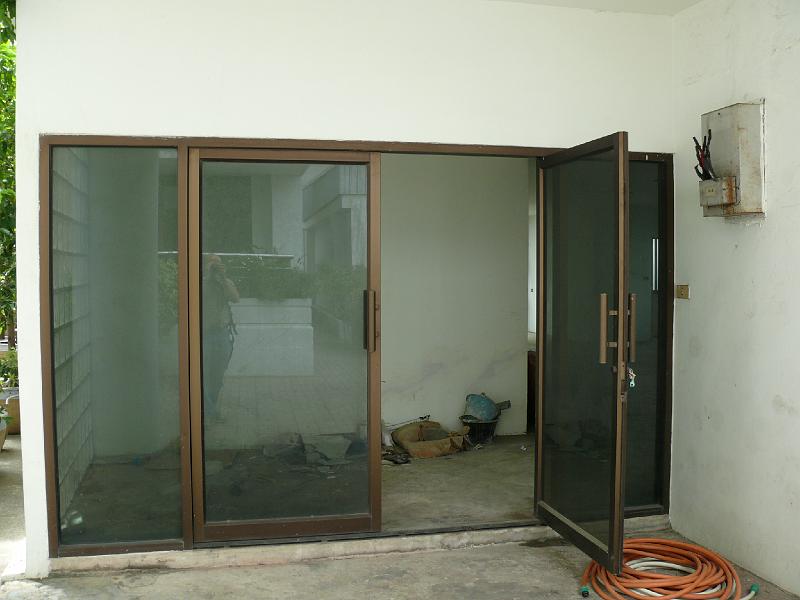 P1000045.JPG - This is the entrance to the unit. (Note that the electric meter just outside the door has not yet been installed.)