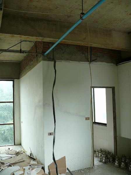 P1000239.JPG - Guest bath with debris pile and removed recessed lighting fixtures.