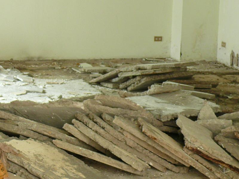 P1000256.JPG - Removed concrete floor tiles. The floor will be replaced with a fresh pouring of concrete. This will be colored and textured to give it a residential feel.