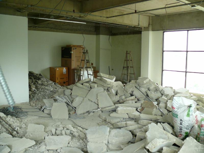 P1000262.JPG - The chunks of concrete tile are thicker than Jon had expected. He figures the replacement floor to be poured will be shallower and should yield 2" more room height.