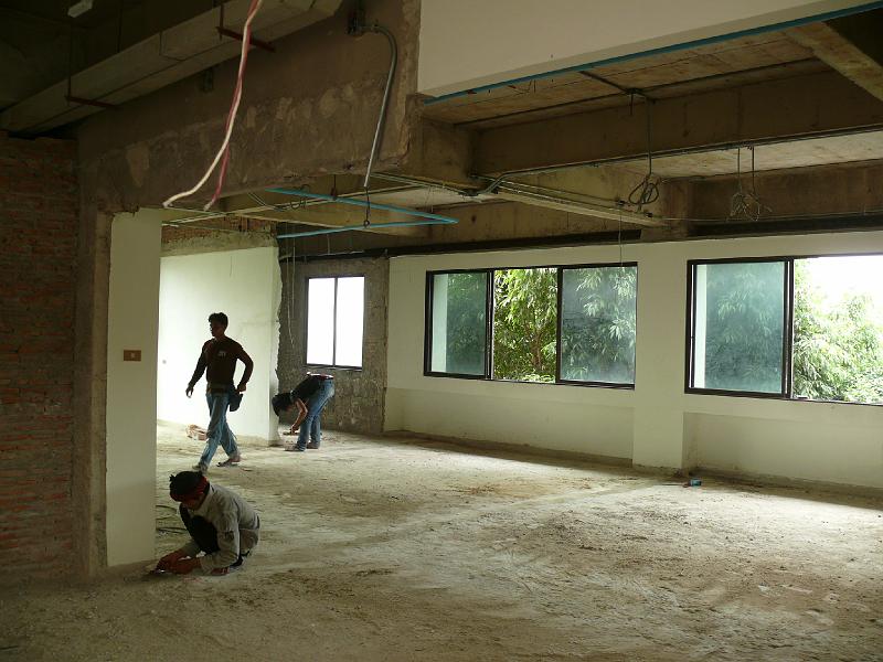 P1000289.JPG - The debris is gone and so are some wall segments. Note the area on the left foreground. That was once the closed-in kitchen. In the right background the doorway wall was removed from the laundry/guest bath.