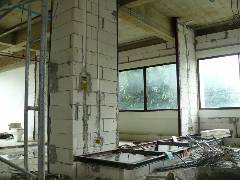 P1000345.JPG - Since the last set of pictures the crew built up the pedestal under the built-in seating seating unit.