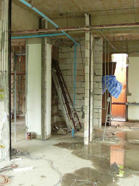 P1000371.JPG - In the center of this photo is the wall beginning to form for a half bath.