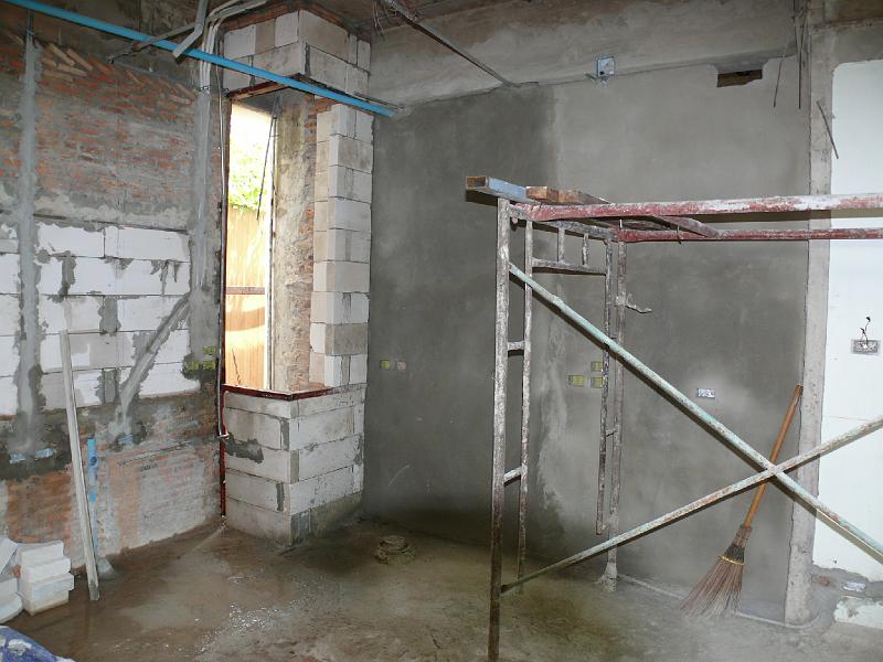 P1000377.JPG - The kitchen. The orignal window has been removed and filled. A more graceful vertical sheet of glass will appear in the corner. This will provide at least as much light but will win back more cupboard space.