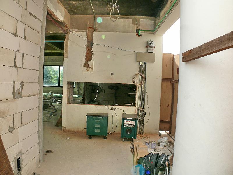 P1000423.JPG - The entrance area. Note that the electric meter has been moved. Also the cutout has appeared for a window into Jon's office.