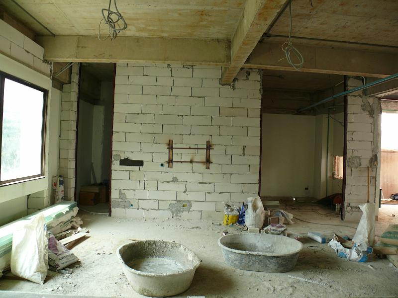 P1000435.JPG - The living room as seen from the guest room. Note the support bracing dead center on the wall. This will hold the TV wall mount.