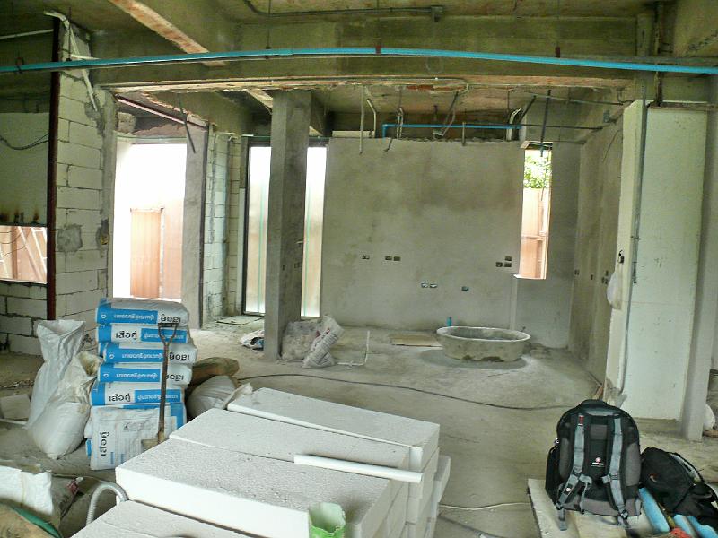 P1000476.JPG - Transition is evident. Walls are being plastered. (Contrast the kitchen wall in background center with Jon's office to the left.)