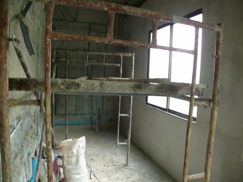 P1000481.JPG - The guest bath/ laundry is partially plastered. (This window is due for replacement.)