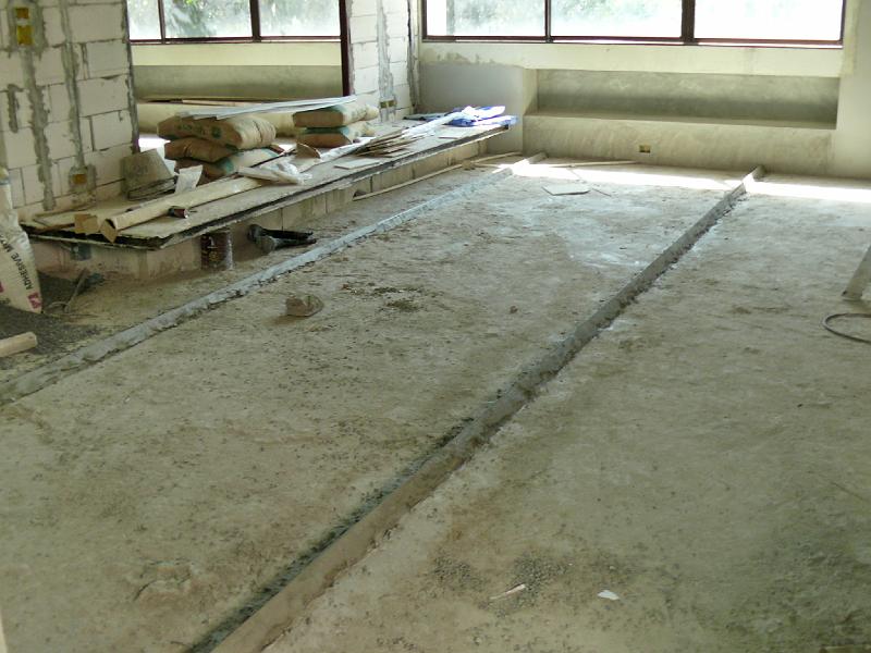 P1000495.JPG - The two ridges will hold the cosmetic flooring layer. Rather than using ceramic or stone tile, Jon's specified a refined concrete finish that will lend a consistent look to the living areas of the apartment.