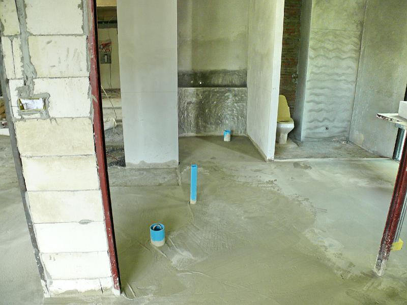 P1000502.JPG - Drain pipes for the master bath's tub (foreground left) and half bath's toilet (center background).