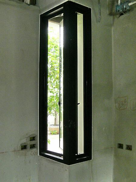 P1000516.jpg - The casement window provides fresh air and also a pleasant view of plans on the north common area.