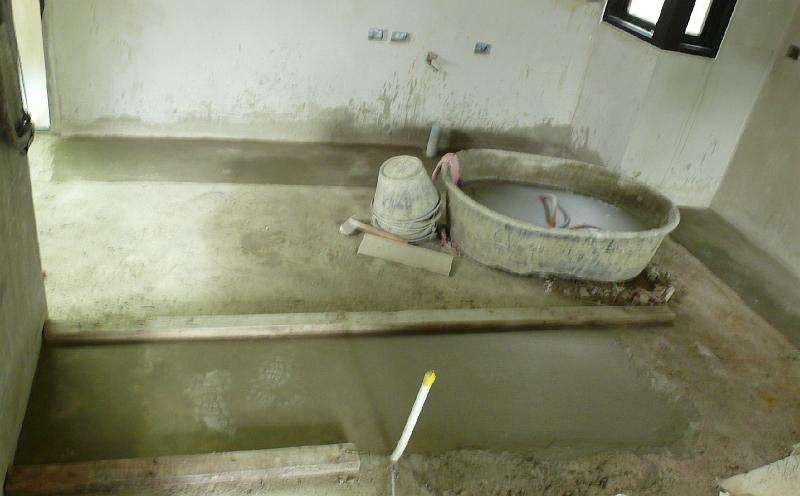 P1000517.jpg - The kitchen floor area. Wooden slats mark the location of a kitchen island.