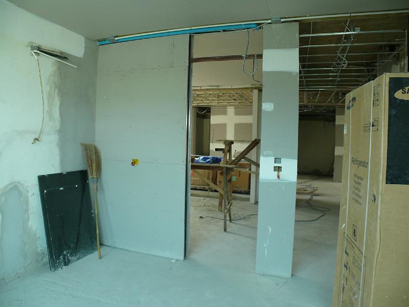 P1000583.JPG - Walls await painting in my work space. (Looking into the guest room (left doorway) and the main hallway (to the right beyond the refrigerator carton).