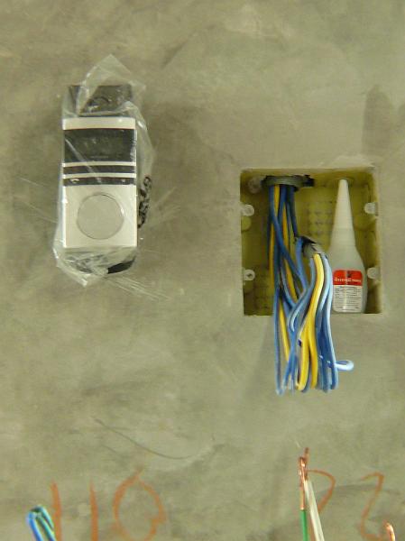 P1000605.JPG - Still covered in it's plastic wrapper is a designer wall telephone from Germany. Calling it "imported" is to be modest. It was shipped by the vendor from Germany to San Francisco. Then from San Francisco by our mail shipper to a friend in Honolulu who hand carried it to Bangkok for us last week.