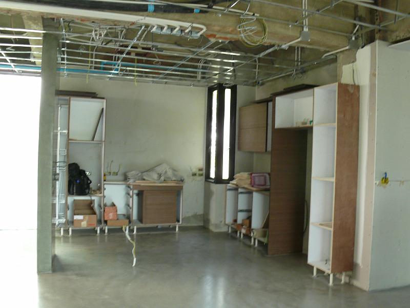 P1000644.JPG - The kitchen island was removed to allow for the floor finishing.