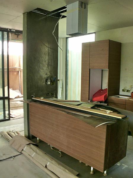 02-P1000667.JPG - The kitchen island is in place and the vertical has been treated with a cement finish similar to the one we've applied to the floor.