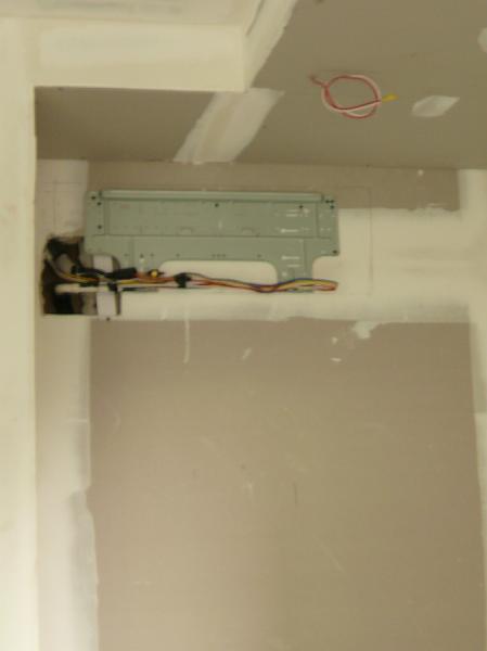 P1000680.JPG - The mounts have been put in place for the air conditioning units. (Jon's office)