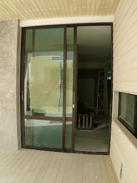 03-P1000742.JPG - The front door. (We're awaiting the permanent glass any day now.)