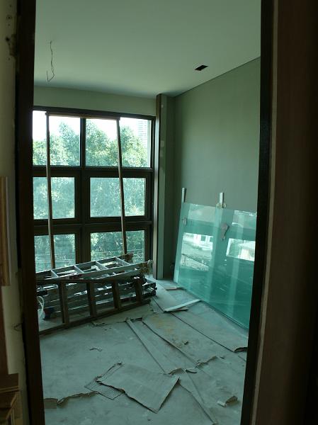 P1000729.JPG - Glass against the right wall of my work area will soon be enclosing portions of the master bath,