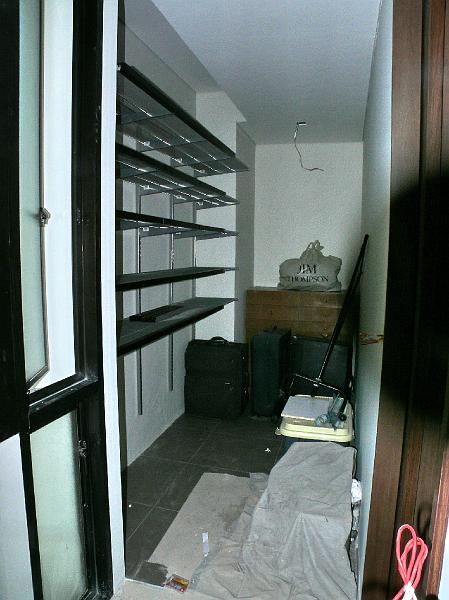 P1000817.jpg - The master walk-in closet.

We shipped in Elfa shelving from The Container Store. These were very successful in our San Francisco condo because they are very easy to install and they are highly functional.