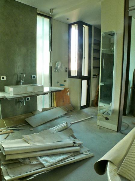 P1000820.jpg - The master bath. In the absence of the crew, Jon today installed a vertical mirrored medicine cabinet (on the pillar background right).