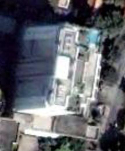 google_earth_140.JPG - Zooming down closer to Habitat sacrifices clarity. Our condo is the rectangle below the white tower. Our western patio is visible below the tower.