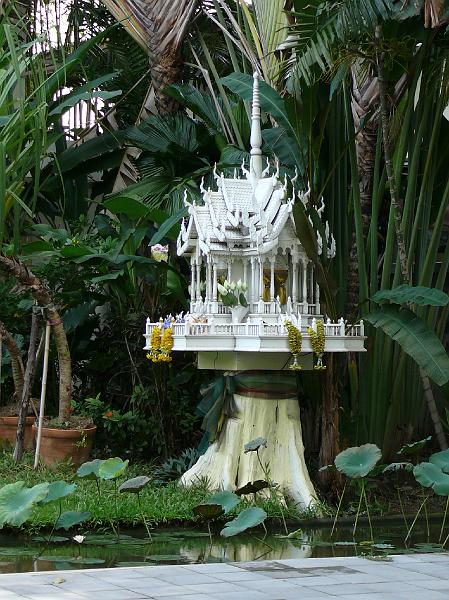 P1000121.JPG - A spirit house gracing a small office building.