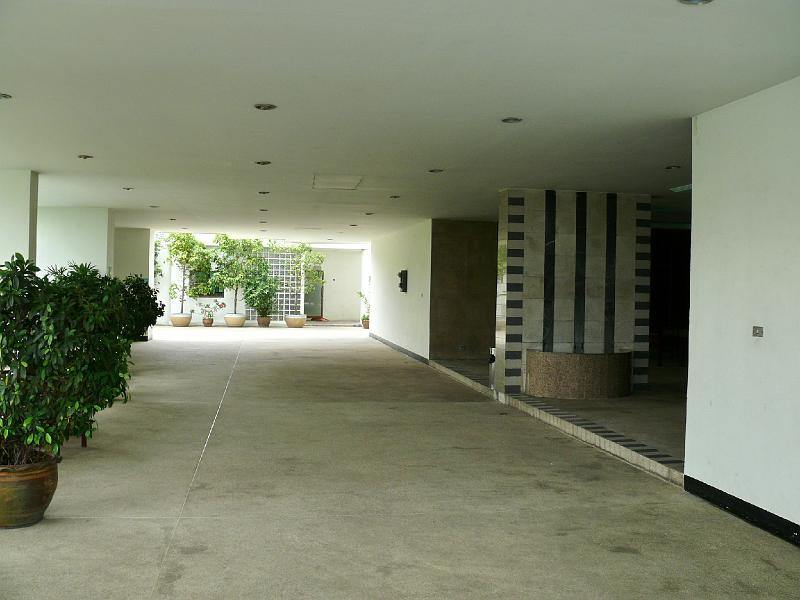P1000034.JPG - Viewing the pathway from the north (elevator lobby at center right). Background reveals the entrance to our condo.
